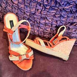White House Black Market Orange wedge, helped sandles. Good condition.